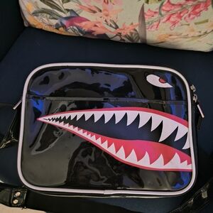 Stylish Black Crossbody Bag with Bold Design